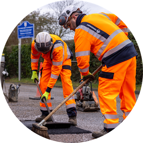 Highways engineers repairing a road