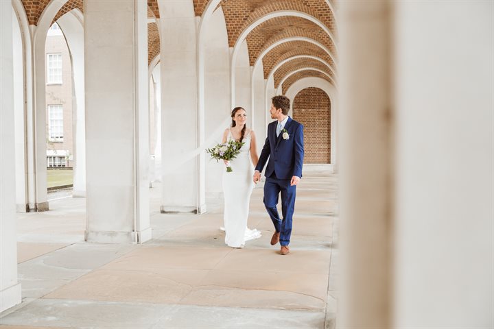 Bride and groom beneath the cloisters at County Hall