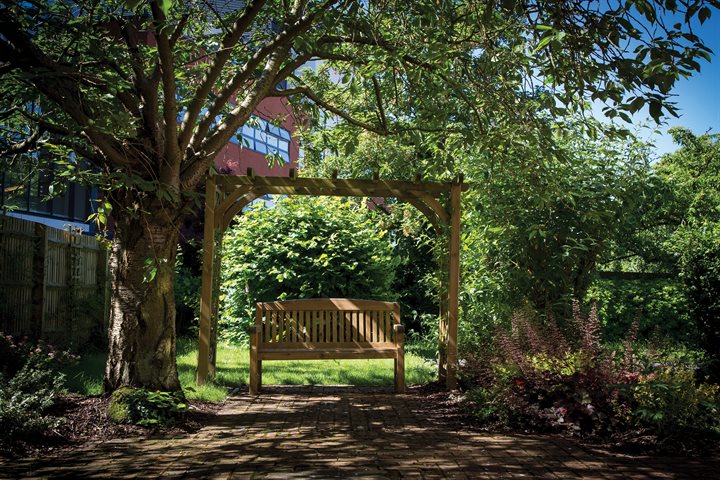 A garden area with bench and pagoda