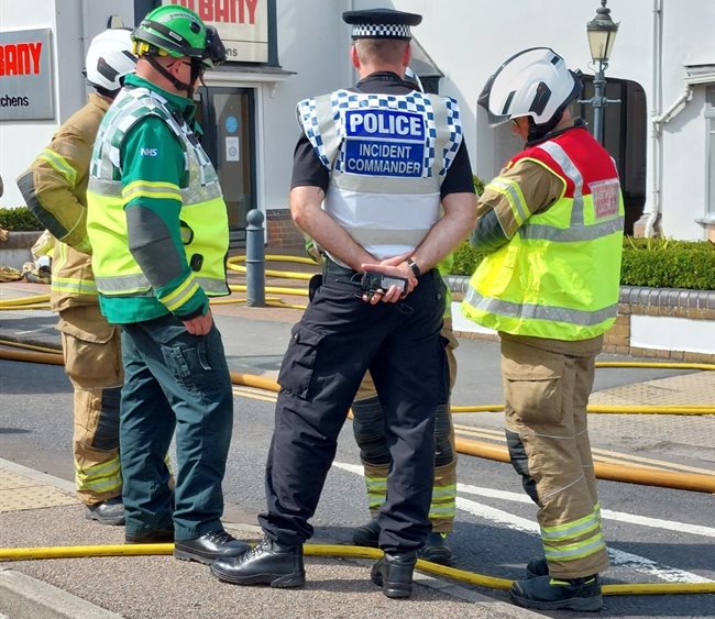 Police with fire and ambulance staff