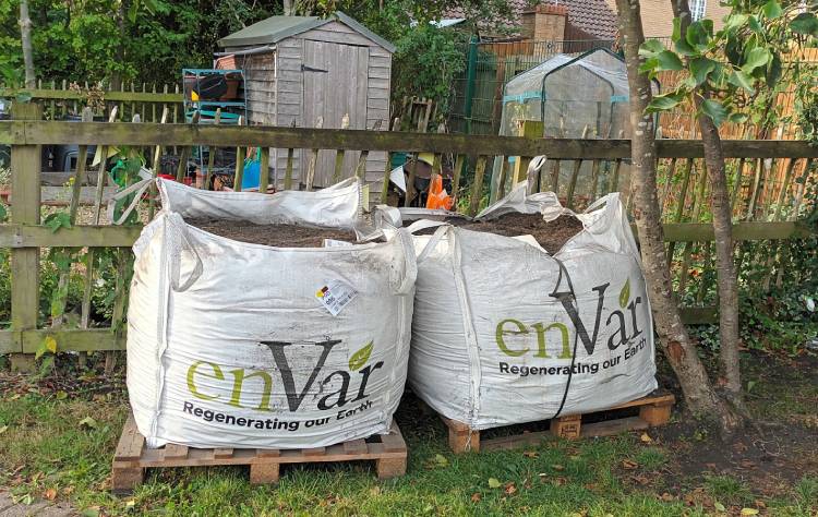 Two large sacks of compost on pallets