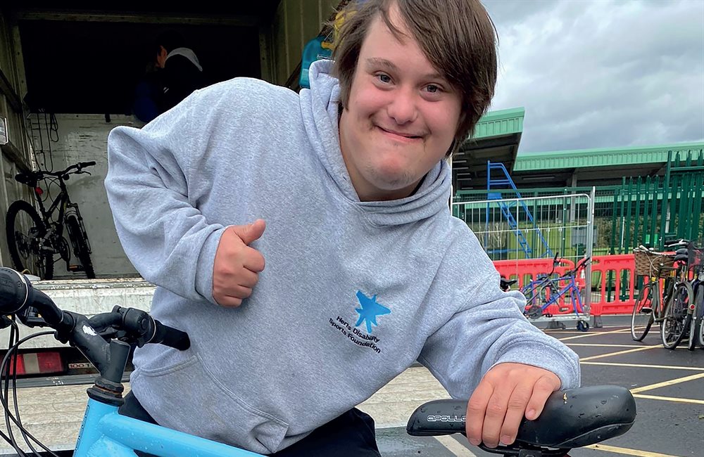 Herts Disability Sports Foundation rep with a donated bike